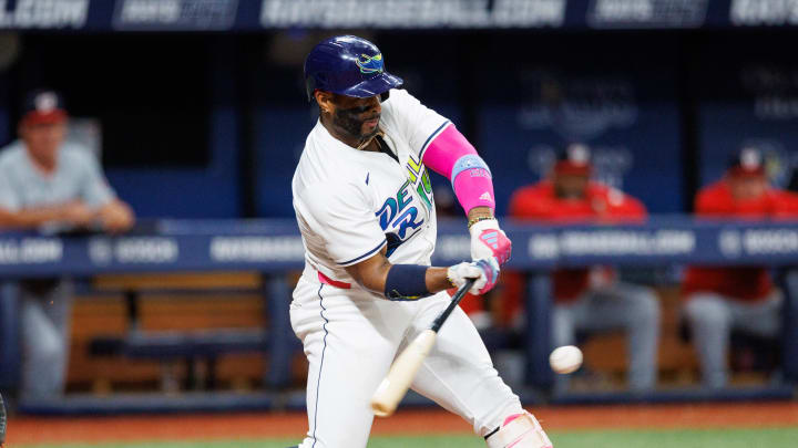 Tampa Bay Rays first baseman Yandy Diaz (2) gets a base hit against the Washington Nationals in the third inning Friday. He now has a team-record 20-game hitting streak.