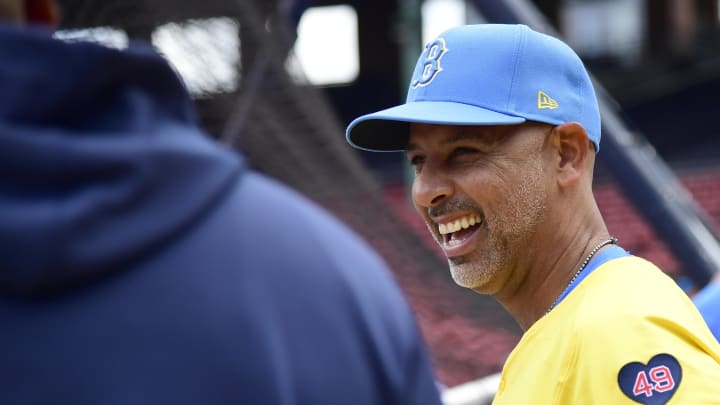 Aug 10, 2024; Boston, Massachusetts, USA;  Boston Red Sox manager Alex Cora has a laugh during batting practice prior to a game against the Houston Astros at Fenway Park. Mandatory Credit: Bob DeChiara-USA TODAY Sports