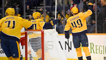 Dec 2, 2025; Nashville, Tennessee, USA;  Nashville Predators left wing Reid Schaefer (49) celebrates his goal against the Calgary Flames during the first period at Bridgestone Arena. Mandatory Credit: Steve Roberts-Imagn Images
