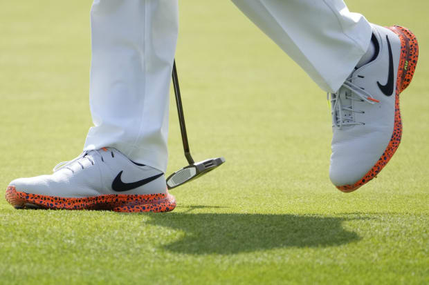 Rory McIlroy's white and orange Nike golf shoes.