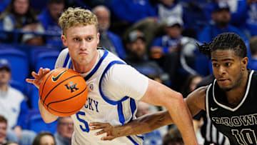 Dec 31, 2024; Lexington, Kentucky, USA; Kentucky Wildcats guard Collin Chandler (5) drives to the basket around Brown Bears guard Kino Lilly Jr. (10) during the second half at Rupp Arena at Central Bank Center. Mandatory Credit: Jordan Prather-Imagn Images