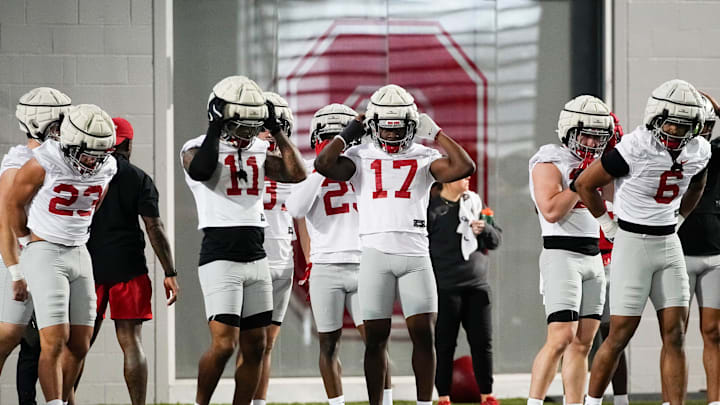 Ohio State Buckeyes linebacker TJ Alford (17) puts on a helmet during spring football practice at the Woody Hayes Athletic Center in Columbus on March 19, 2025.
