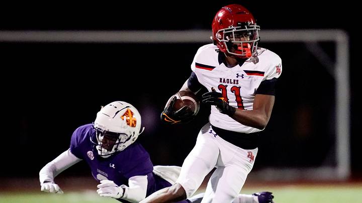 Brentwood Academy's Kesean Bowman (11) escapes from Father Ryan's Mason Bryant (3) during the second quarter at Father Ryan High School in Nashville, Tenn., Friday, Nov. 15, 2024.