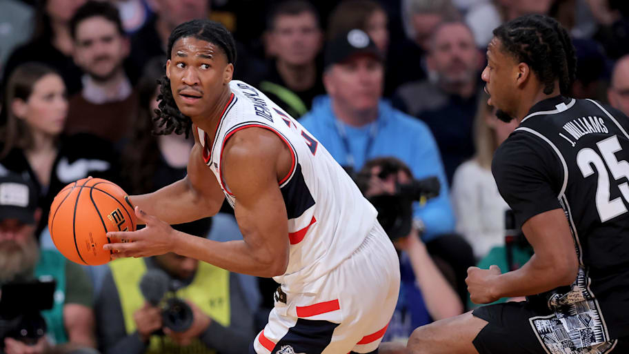 Silas Demary Jr. looks to pass the ball against Georgetown guard Jeremiah Williams during a game this season.