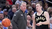 Purdue coach Matt Painter (left) talks with guard Fletcher Loyer during the Boilermakers' game at Marquette last week.