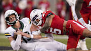 Oct 25, 2025; Cincinnati, Ohio, USA;  Baylor Bears quarterback Sawyer Robertson (13) runs with the ball as he is tackled by Cincinnati Bearcats safety Christian Harrison (5) in the second half at Nippert Stadium. Mandatory Credit: Aaron Doster-Imagn Images