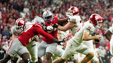 Indiana Hoosiers quarterback Fernando Mendoza (15) scrambles away from Ohio State Buckeyes defensive end Kenyatta Jackson Jr. (97) during the Big Ten Conference championship game at Lucas Oil Stadium in Indianapolis on Dec. 6, 2025. Ohio State lost 13-10.