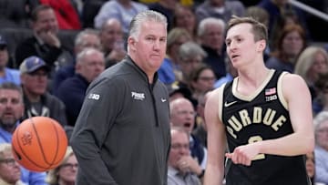 Purdue coach Matt Painter (left) talks with guard Fletcher Loyer during the Boilermakers' game at Marquette last week.