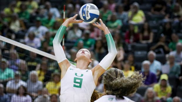 Oregon setter Hannah Pukis sets the ball as Oregon volleyball takes on Portland State in an exhibition match Saturday, Aug. 19, 2023, at Matthew Knight Arena in Eugene.