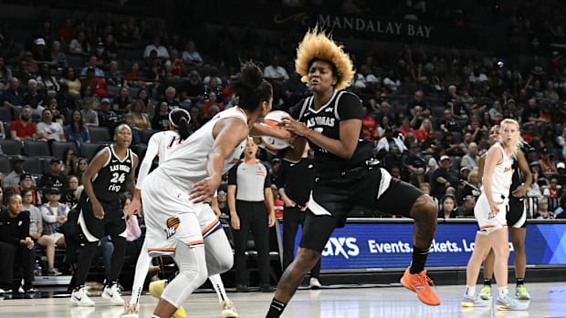 A photo of Alyssa Thomas fouling NaLyssa Smith