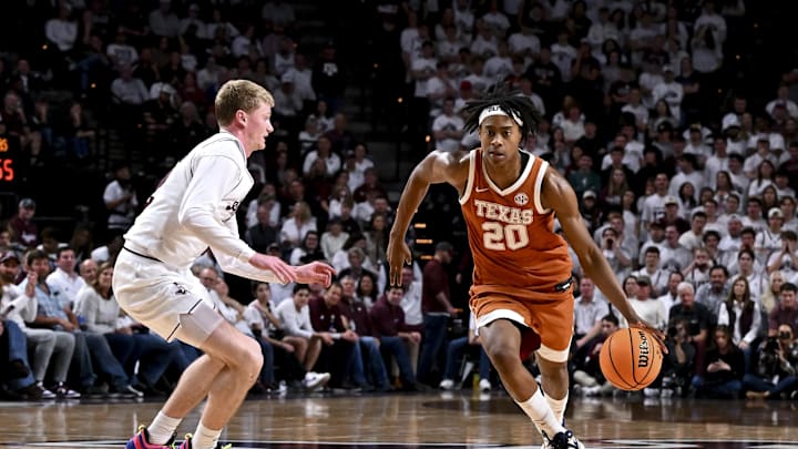 Jan 4, 2025; College Station, Texas, USA; Texas Longhorns guard Tre Johnson (20) brings the ball down court as Texas A&M Aggies guard Hayden Hefner (2) defends during the second half at Reed Arena. The Aggies defeated the Longhorns 80-60. Mandatory Credit: Maria Lysaker-Imagn Images 