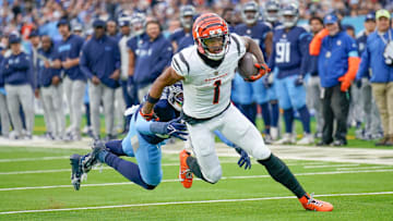 Cincinnati Bengals wide receiver Ja'Marr Chase (1) catches a pass over Tennessee Titans linebacker James Williams (52) during the second quarter at Nissan Stadium in Nashville, Tenn., Sunday, Dec. 15, 2024.