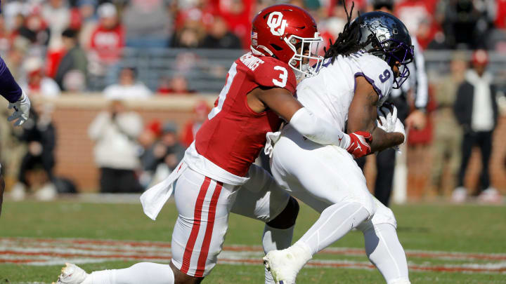 Oklahoma Sooners defensive back Robert Spears-Jennings (3) brings down TCU Horned Frogs running back Emani Bailey (9) during a college football game between the University of Oklahoma Sooners (OU) and the TCU Horned Frogs at Gaylord Family-Oklahoma Memorial Stadium in Norman, Okla., Friday, Nov. 24, 2023. Oklahoma won 69-45.