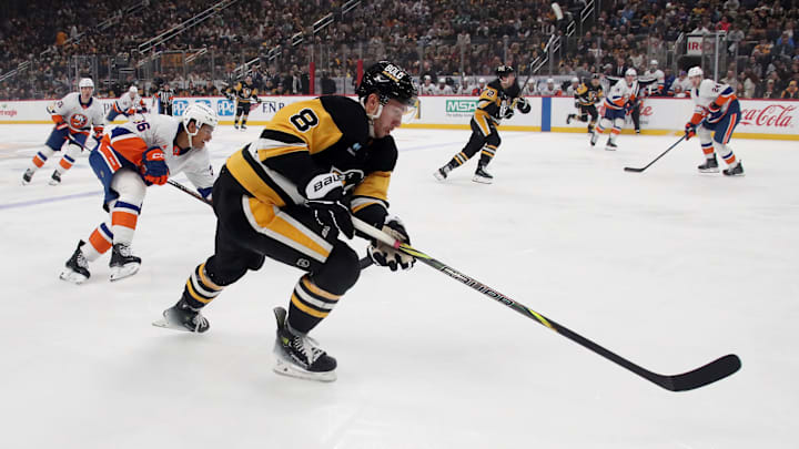 Dec 29, 2024; Pittsburgh, Pennsylvania, USA; Pittsburgh Penguins left wing Michael Bunting (8) skates into the New York Islanders zone with the puck during the first period at PPG Paints Arena. Mandatory Credit: Charles LeClaire-Imagn Images Dec 29, 2024; Pittsburgh, Pennsylvania, USA; Pittsburgh Penguins left wing Michael Bunting (8) skates into the New York Islanders zone with the puck during the first period at PPG Paints Arena. Mandatory Credit: Charles LeClaire-Imagn Images
