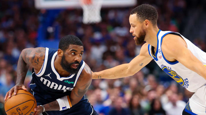 Apr 5, 2024; Dallas, Texas, USA;  Dallas Mavericks guard Kyrie Irving (11) looks to score as Golden State Warriors guard Stephen Curry (30) defends during the first half at American Airlines Center. Mandatory Credit: Kevin Jairaj-USA TODAY Sports