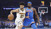 Denver guard Jamal Murray moves the ball down the court against Oklahoma City guard Luguentz Dort in a playoff game last season.