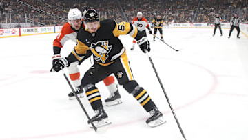 Feb 27, 2025; Pittsburgh, Pennsylvania, USA;  Pittsburgh Penguins right wing Rickard Rakell (67) controls the puck against Philadelphia Flyers defenseman Travis Sanheim (6) during the first period at PPG Paints Arena. Mandatory Credit: Charles LeClaire-Imagn Images
