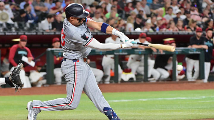 Minnesota Twins third baseman Royce Lewis (23) hits an RBI single in the second inning against the Arizona Diamondbacks at Chase Field in Phoenix on June 27, 2024.