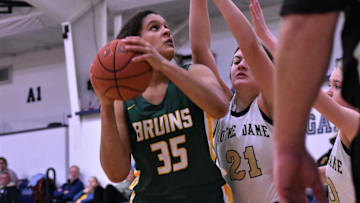 Rock Bridge's Jayda Porter (35) battles the Quincy Notre Dame defense during the Sophie Cunningham Classic on Dec. 4, 2022, at Columbia, Mo.

Dsc 1228 2