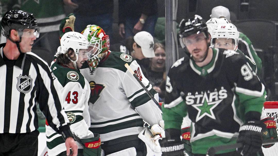 Apr 28, 2026; Dallas, Texas, USA; Minnesota Wild defenseman Quinn Hughes (43) and goaltender Jesper Wallstedt (30) celebrate as Dallas Stars center Matt Duchene (95) skates off the ice after game five of the first round of the 2026 Stanley Cup Playoffs at American Airlines Center. Mandatory Credit: Jerome Miron-Imagn Images