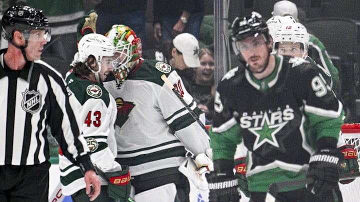 Apr 28, 2026; Dallas, Texas, USA; Minnesota Wild defenseman Quinn Hughes (43) and goaltender Jesper Wallstedt (30) celebrate as Dallas Stars center Matt Duchene (95) skates off the ice after game five of the first round of the 2026 Stanley Cup Playoffs at American Airlines Center. Mandatory Credit: Jerome Miron-Imagn Images