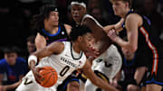 Mar 9, 2024; Nashville, Tennessee, USA; Vanderbilt Commodores guard Tyrin Lawrence (0) drives to the basket against Florida Gators guard Walter Clayton Jr. (1) during the first half at Memorial Gymnasium. Mandatory Credit: Christopher Hanewinckel-Imagn Images