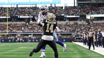 Sep 15, 2024; Arlington, Texas, USA; Dallas Cowboys wide receiver CeeDee Lamb (88) cannot catch a pass while defended by New Orleans Saints cornerback Kool-Aid McKinstry (14) at AT&T Stadium. Mandatory Credit: Tim Heitman-Imagn Images