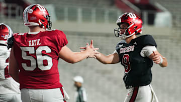 Indiana Hoosiers offensive lineman Mike Katic (56) celebrates with Indiana Hoosiers quarterback Kurtis Rourke (9) after a touchdown during the Indiana football spring game at Memorial Stadium on Thursday, April 18, 2024.