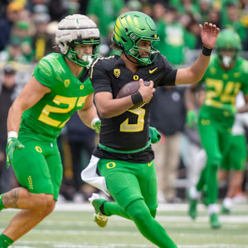 Oregon quarterback Dante Moore carries the ball during the Oregon Ducks’ Spring Game Saturday, April 27. 2024 at Autzen Stadium in Eugene, Ore.