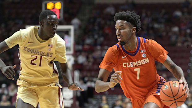 Clemson Tigers forward Chauncey Wiggins (7) drives around Florida State Seminoles forward Alier Maluk