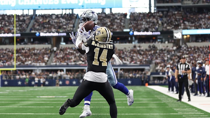 Sep 15, 2024; Arlington, Texas, USA; Dallas Cowboys wide receiver CeeDee Lamb (88) cannot catch a pass while defended by New Orleans Saints cornerback Kool-Aid McKinstry (14) at AT&T Stadium. Mandatory Credit: Tim Heitman-Imagn Images