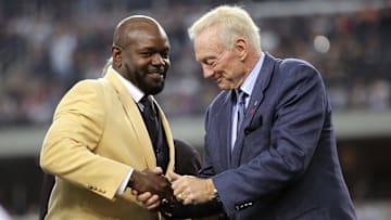Nov 21, 2010; Arlington, TX, USA; Dallas Cowboys former running back Emmitt Smith (left) shakes owner Jerry Jones hand after being presented his hall of fame ring at halftime of the game against the Detroit Lions at Cowboys Stadium. Mandatory Credit: Matthew Emmons- Imagn Images