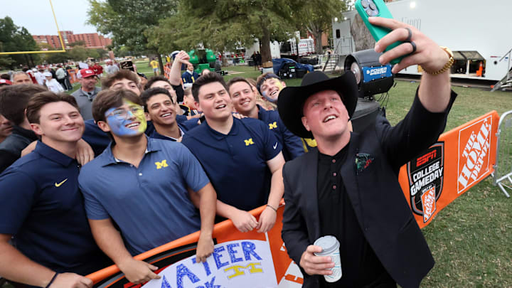 Pat McAfee with Michigan fans on his way to the stage at ESPN College GameDay ahead of the Oklahoma-Michigan college football