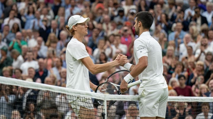 Jul 14, 2023; London, United Kingdom; Novak Djokovic (SRB) and Jannik Sinner (ITA) at the net after their match on day 12 of Wimbledon at the All England Lawn Tennis and Croquet Club.  Mandatory Credit: Susan Mullane-USA TODAY Sports 