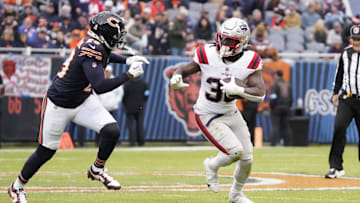 Nov 10, 2024; Chicago, Illinois, USA; Chicago Bears cornerback Tyrique Stevenson (29) tries to tackle New England Patriots running back Rhamondre Stevenson (38) during the second half at Soldier Field. Mandatory Credit: David Banks-Imagn Images