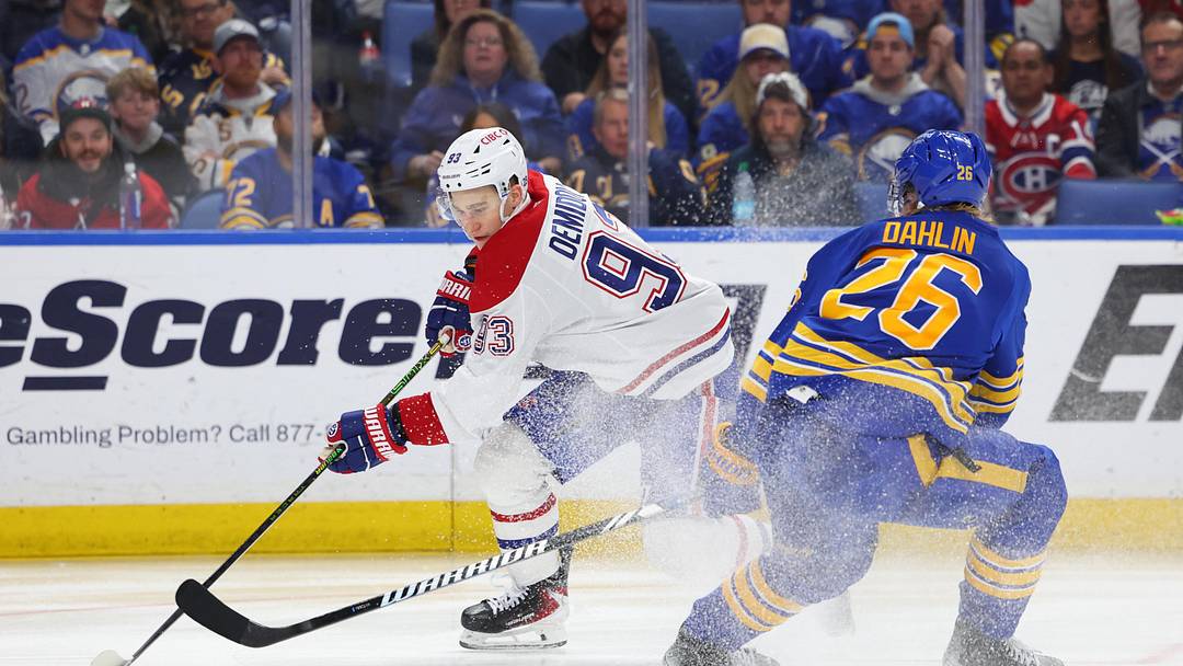 May 14, 2026; Buffalo, New York, USA; Montréal Canadiens right wing Ivan Demidov (93) controls the puck as Buffalo Sabres defenseman Rasmus Dahlin (26) defends during the third period in game five of the second round of the 2026 Stanley Cup Playoffs at KeyBank Center. Mandatory Credit: Timothy T. Ludwig-Imagn Images