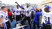 Nov 30, 2013; Chapel Hill, NC, USA;  Duke Blue Devils linebacker Chris Hoover (53) and tight end David Reeves (80) and defensive end Kenny Anunike (84) and cornerback Breon Borders (31) with the victory bell after the game. The Duke Blue Devils defeated the North Carolina Tar Heels 27-25 at Kenan Memorial Stadium. Mandatory Credit: Bob Donnan-Imagn Images