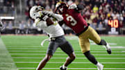 Nov 15, 2025; Chestnut Hill, Massachusetts, USA; Georgia Tech Yellow Jackets wide receiver Eric Rivers (3) catches the ball while Boston College Eagles defensive back Max Tucker (3) defends during the second half at Alumni Stadium. Mandatory Credit: Bob DeChiara-Imagn Images