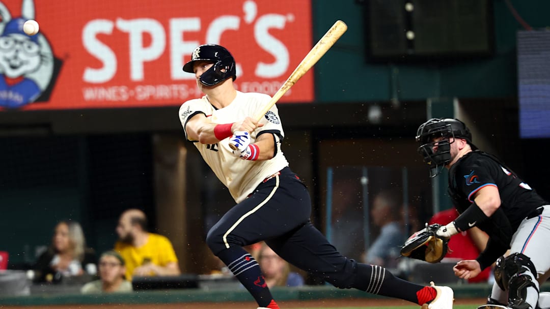 Sep 19, 2025; Arlington, Texas, USA;  Texas Rangers third baseman Josh Jung (6) hits an rbi single during the second inning against the Miami Marlins at Globe Life Field. 