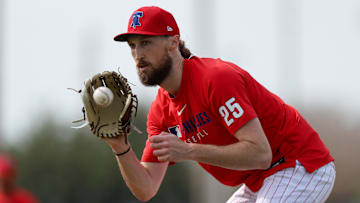 Feb 19, 2025; Clearwater, FL, USA; Philadelphia Phillies pitcher Matt Strahm (25) takes infield practice during spring training workouts at BayCare Ballpark.