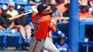 Mar 13, 2025; Dunedin, Florida, USA; Baltimore Orioles third baseman Coby Mayo (16) doubles against the Toronto Blue Jays in the second inning during spring training at TD Ballpark. 
