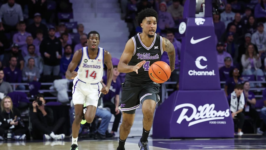 Jan 24, 2026; Manhattan, Kansas, USA; Kansas State Wildcats guard P.J. Haggerty (4) brings the ball up court during the first half against the Kansas Jayhawks at Bramlage Coliseum. Mandatory Credit: Scott Sewell-Imagn Images