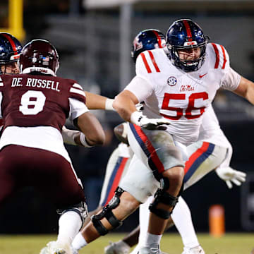 Nov 23, 2023; Starkville, Mississippi, USA; Mississippi Rebels offensive linemen Jeremy James (left) and Mississippi Rebels offensive linemen Reece McIntyre (56) block during the second half  against the Mississippi State Bulldogs at Davis Wade Stadium at Scott Field. Mandatory Credit: Petre Thomas-Imagn Images