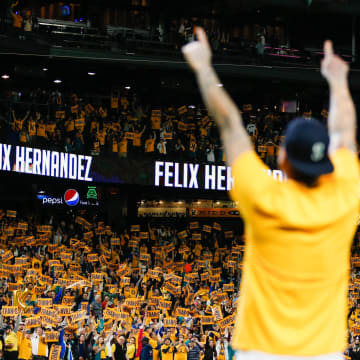 Seattle Mariners starting pitcher Felix Hernandez (34) celebrates with fans following a 3-1 loss against the Oakland Athletics at T-Mobile Park in 2019.