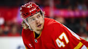 Dec 12, 2024; Calgary, Alberta, CAN; Calgary Flames center Connor Zary (47) during the face off against the Tampa Bay Lightning during the second period at Scotiabank Saddledome. Mandatory Credit: Sergei Belski-Imagn Images