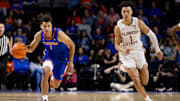 Nov 17, 2023; Gainesville, Florida, USA; Florida Gators guard Walter Clayton Jr. (1) dribbles the ball past Florida State Seminoles guard Jalen Warley (1) during the second half at Exactech Arena at the Stephen C. O'Connell Center. Mandatory Credit: Matt Pendleton-Imagn Images