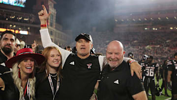 Sep 28, 2024; Lubbock, Texas, USA;  Texas Tech Red Raiders head coach Joey McGuire and associate head coach Kenny Perry after the game against the Cincinnati Bearcats at Jones AT&T Stadium and Cody Campbell Field. Mandatory Credit: Michael C. Johnson-Imagn Images