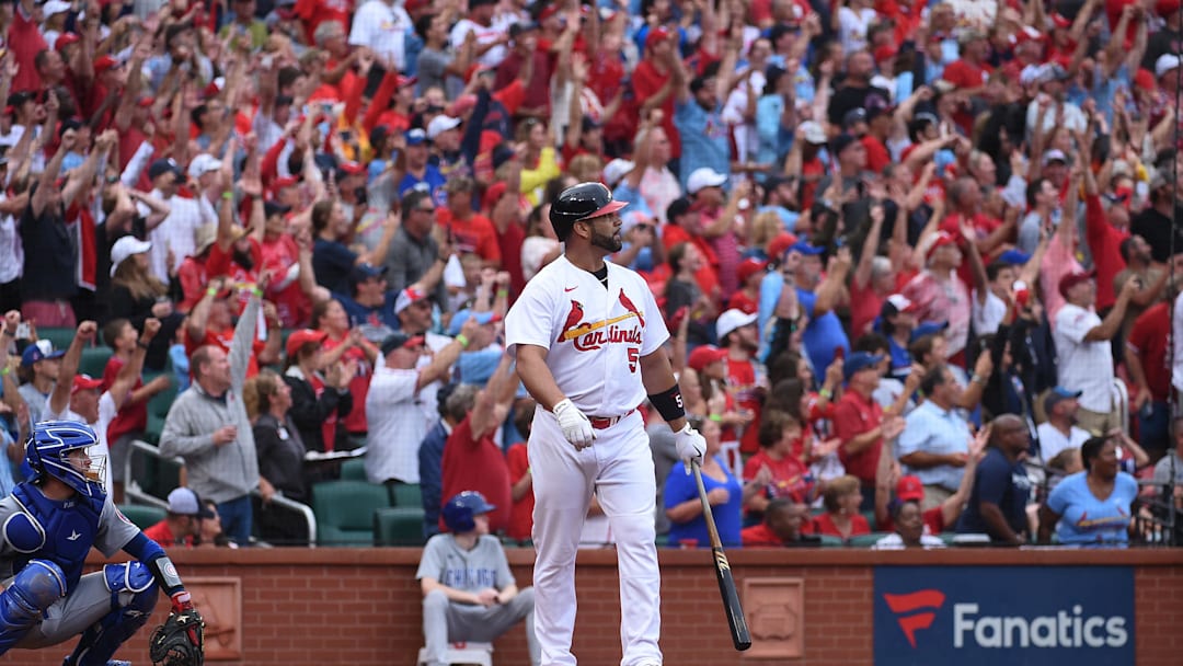 Sep 4, 2022; St. Louis, Missouri, USA; St. Louis Cardinals pinch hitter Albert Pujols (5) hits a two-run home run against the Chicago Cubs in the eighth inning at Busch Stadium. Mandatory Credit: Joe Puetz-Imagn Images