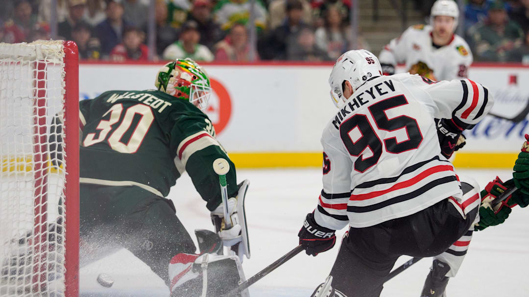 Mar 19, 2026; Saint Paul, Minnesota, USA; Chicago Blackhawks right wing Ilya Mikheyev (95) redirects a pass behind Minnesota Wild goaltender Jesper Wallstedt (30) to score in the first period at Grand Casino Arena. Mandatory Credit: Matt Blewett-Imagn Images