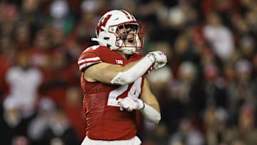 Nov 11, 2023; Madison, Wisconsin, USA;  Wisconsin Badgers safety Hunter Wohler (24) celebrates following a play during the third quarter against the Northwestern Wildcats at Camp Randall Stadium. Mandatory Credit: Jeff Hanisch-Imagn Images